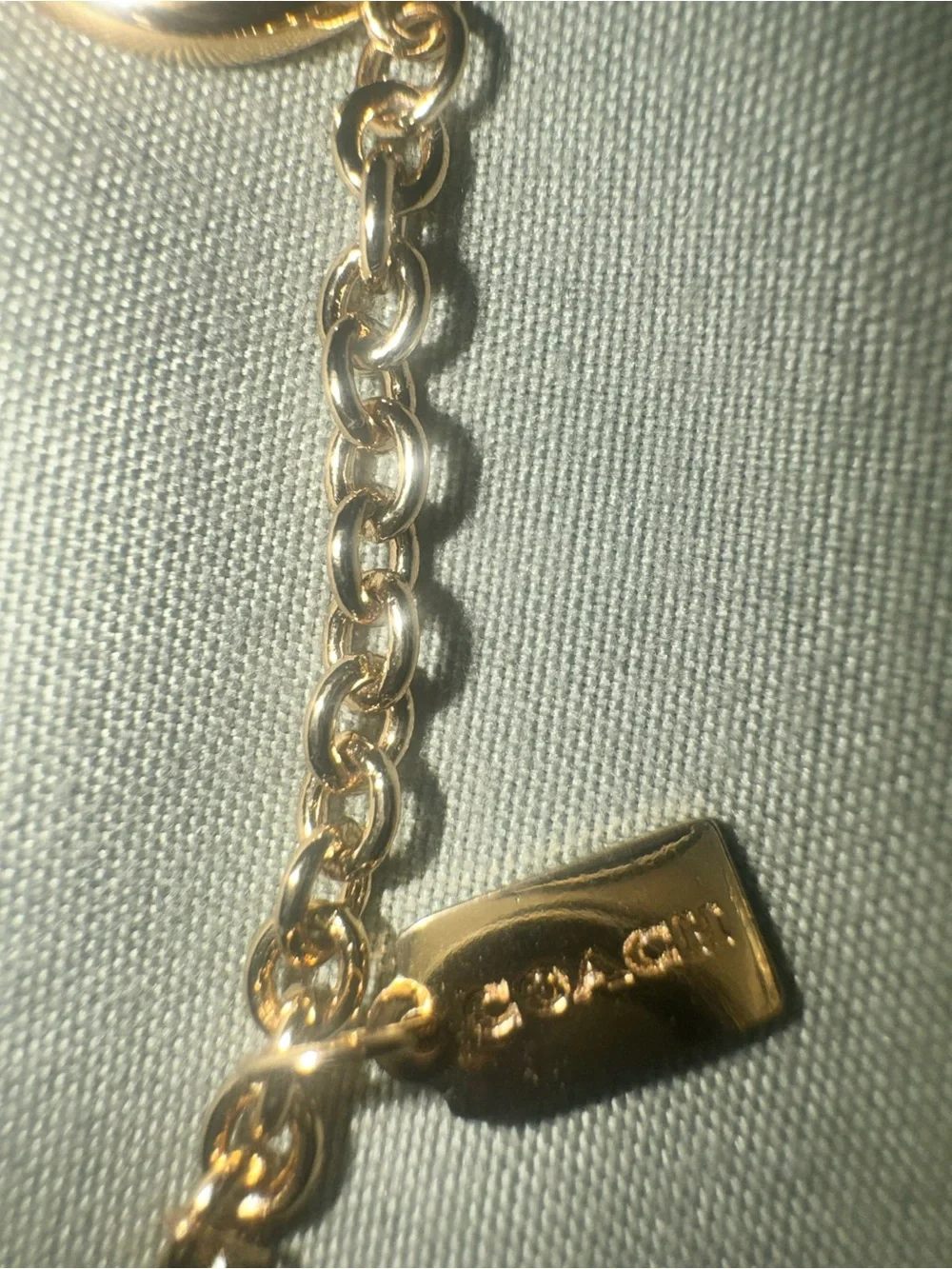 Coach Gold tone Charm Bracelet with Padlock, Key and Pearl Accents CD855 A31